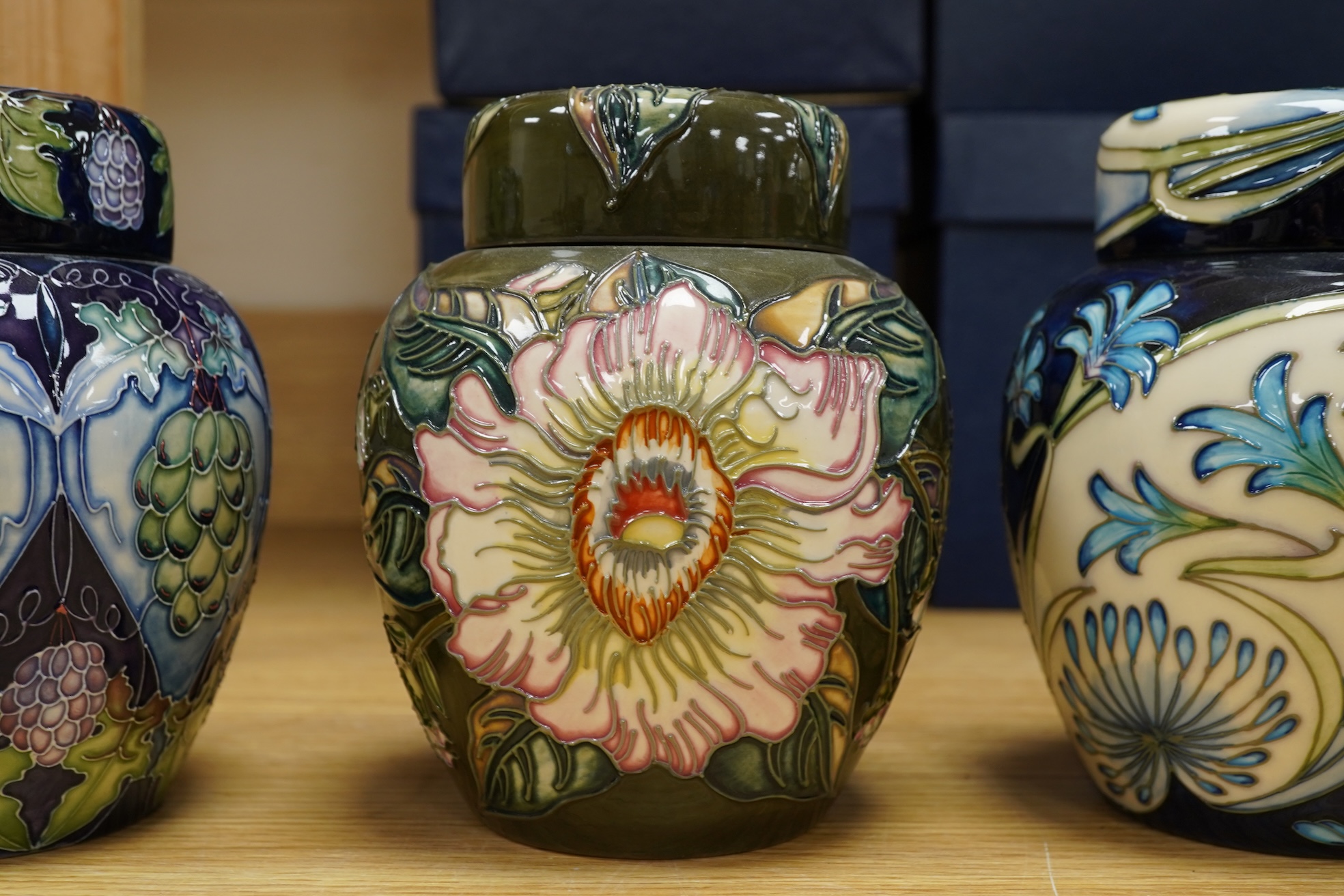 Four Moorcroft ginger jars and covers - ‘Midnight Blue’, ‘Inula’, ‘Sonans’ and ‘Gustav Augusta’ (4) 17cm high